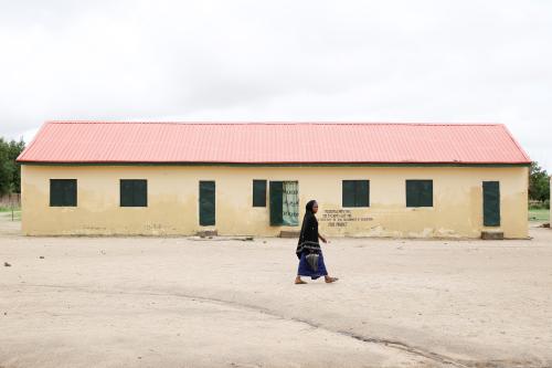 A woman walks past the Hausari primary school in Michika village, northeast Nigeria June 12, 2017. Picture taken June 12, 2017. REUTERS/Akintunde Akinleye - RC1AFAC79A10