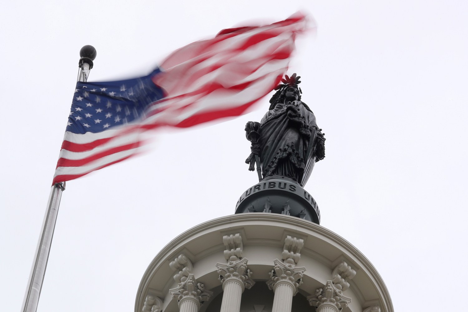 The U.S. flag flies near the Statue of Freedom atop the U.S. Capitol in Washington, U.S. November 2, 2018. REUTERS/Jonathan Ernst - RC145C0624F0