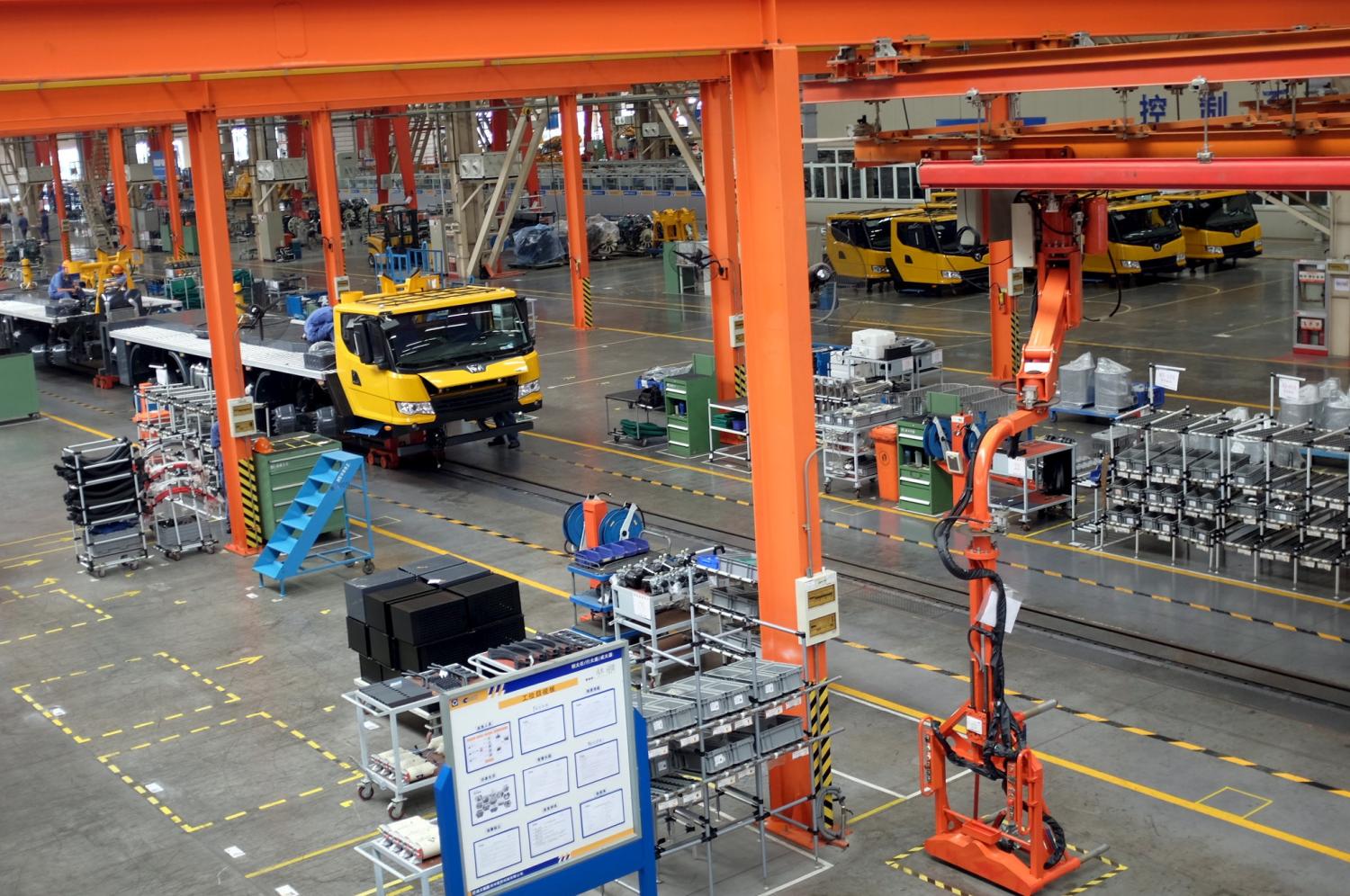 A factory floor of XCMG Group is seen in Xuzhou, Jiangsu province, China August 14, 2015. Two years after China unveiled a sweeping plan to rebuild Silk Road trade links with Europe and Asia, machinery maker XCMG Group has opened a factory in Uzbekistan, sent 300 staff abroad and set ambitious goals to grow overseas. XCMG's foreign venture piggybacks on China's bold scheme to extend its global influence through financing infrastructure projects in 65 nations that are home to two-thirds of humanity, and at the same time win new markets for companies weighed down by profit-crushing overcapacity at home. Picture taken August 14, 2015. REUTERS/Brenda Goh - GF10000192838