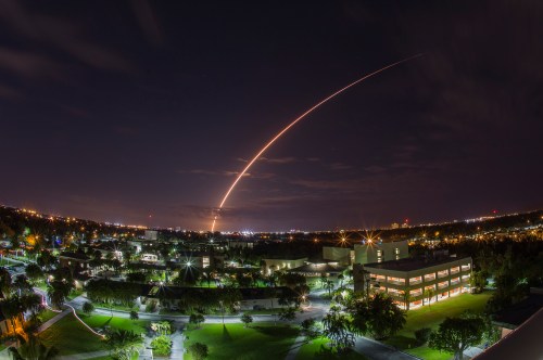 A United Launch Alliance Atlas V 551 rocket blasts off from Cape Canaveral Air Force Station in Florida, January 20, 2015. The unmanned rocket blasted off with a next-generation communications satellite designed to provide cellular-like voice and data services to U.S. military forces around the world. Picture taken using long exposure, looking over the campus of Florida Institute of Technologies in Melbourne, about 40 miles from the launch pad. REUTERS/Michael Brown  (UNITED STATES - Tags: SCIENCE TECHNOLOGY MILITARY TPX IMAGES OF THE DAY) - GM1EB1L0SXU01