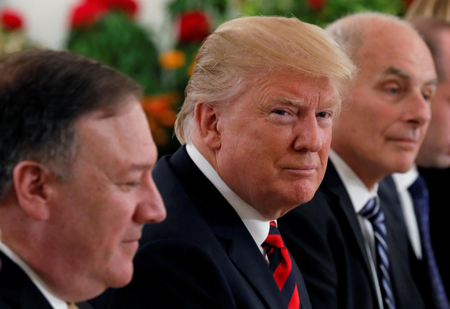 U.S. President Donald Trump flanked by Secretary of State Mike Pompeo and White House Chief of Staff John Kelly attend a lunch with Singapore's Prime Minister Lee Hsien Loong and officials at the Istana in Singapore June 11, 2018.  REUTERS/Jonathan Ernst     TPX IMAGES OF THE DAY - RC1DD6963FF0