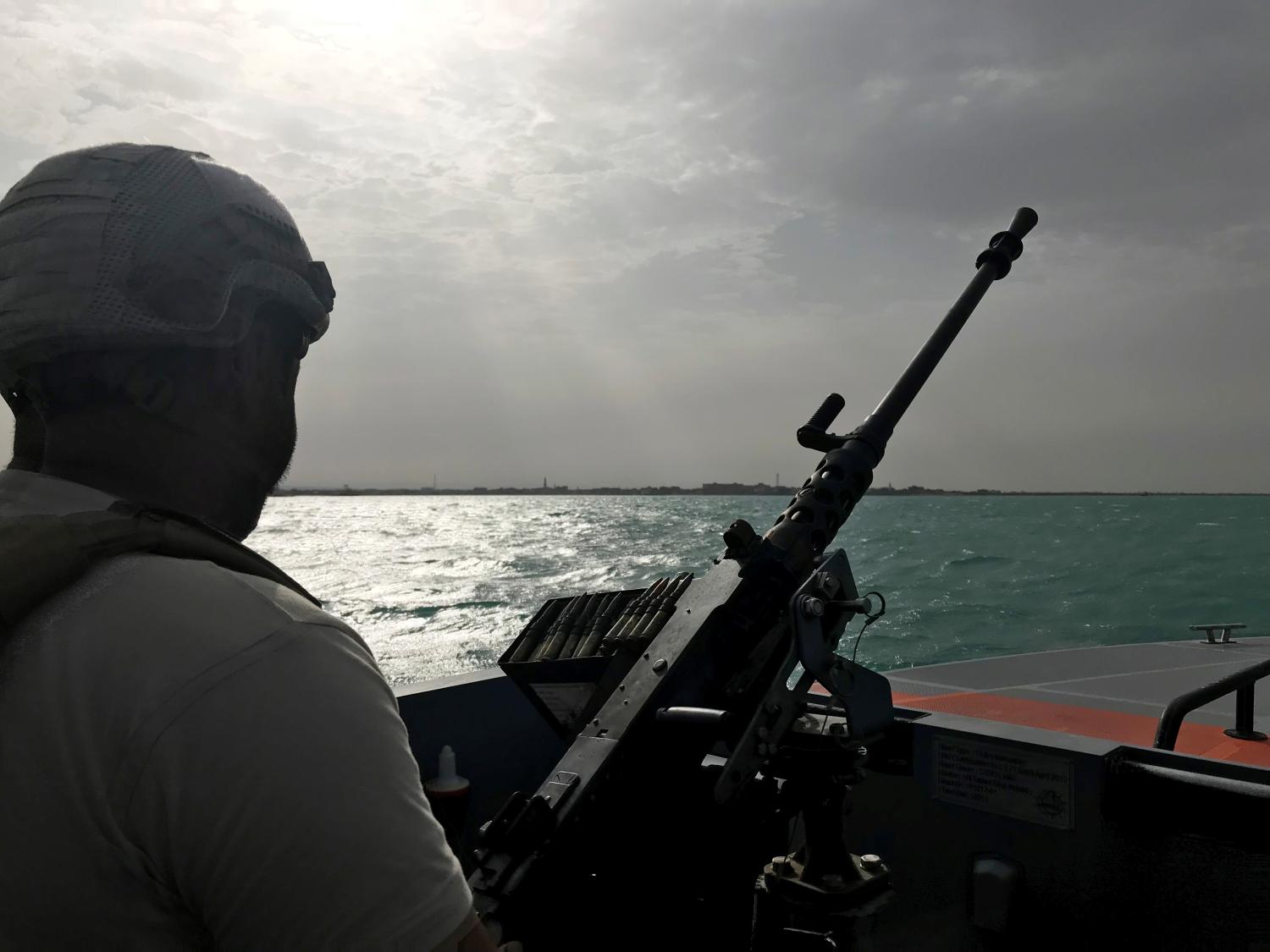 UAE navy soldier patrols at Al-Mokha port in Yemen