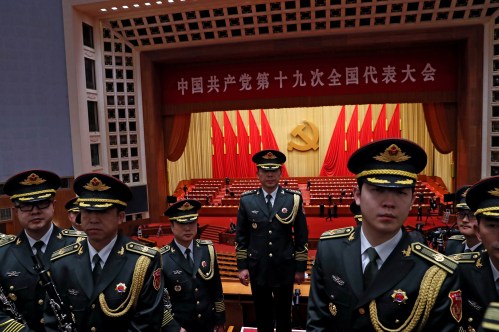 Military band members react after the closing session of the 19th National Congress of the Communist Party of China at the Great Hall of the People, in Beijing, China October 24, 2017. REUTERS/Tyrone Siu - RC1758C814D0