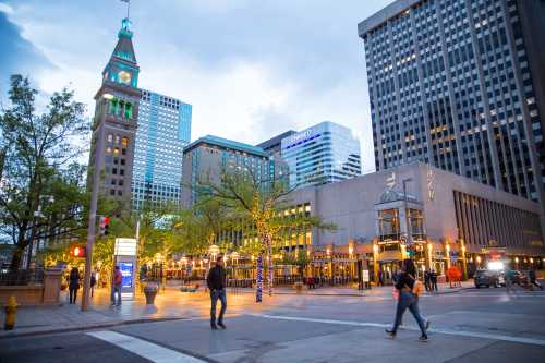 Pedestrians walk in Denver