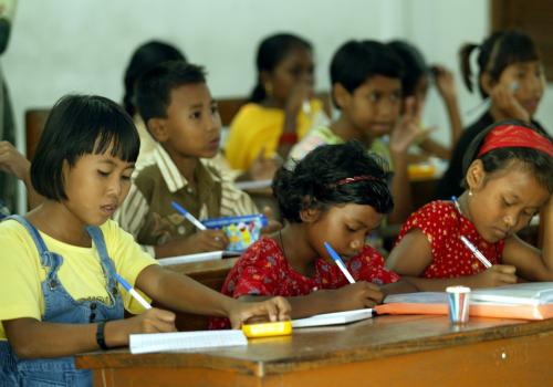 Young Nicobarese tsunami survivors study in a classroom in a relief camp in Port Blair, the capital of India's Andaman and Nicobar archipelago January 13, 2005. [India, which had shunned foreign help for its tsunami victims, has now allowed UNICEF to help mount a campaign in the battered Andaman and Nicobar islands to prevent an outbreak of measles and blindness among children.] - PBEAHUODMFX