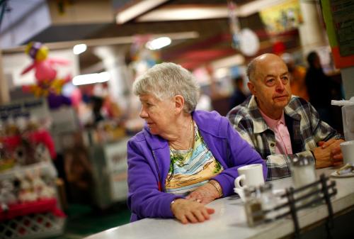 Nora and Anthony Szeluga sit at the counter of Perison's diner in the Broadway Market in Buffalo, New York April 10, 2011. The city is a part of America's Midwestern "Rust Belt", the heartland of the country and home to big unionized manufacturers like the auto and steel industries. Once a thriving farmer's market, the historic space has managed to survive, and even thrive around holidays like Easter. The couple, who once lived in the neighborhood, only return to the market, where Anthony used to sell produce as a child, twice a year, Easter and Christmas. Picture taken April 10. REUTERS/Eric Thayer (UNITED STATES - Tags: BUSINESS FOOD) - GM1E74C0E5G01