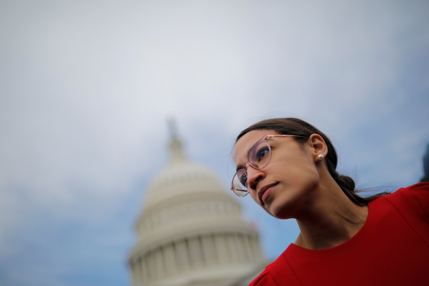 Democratic Representative-elect Alexandria Ocasio-Cortez of New York (L) arrives for a class photo with incoming newly elected members of the U.S. House of Representatives on Capitol Hill in Washington, U.S., November 14, 2018. REUTERS/Carlos Barria - RC124C44C420