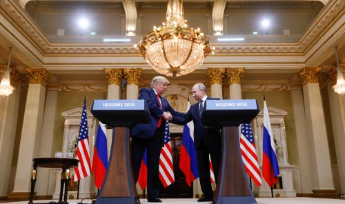 U.S. President Donald Trump and Russia's President Vladimir Putin shake hands during a joint news conference after their meeting in Helsinki, Finland, July 16, 2018. REUTERS/Kevin Lamarque - RC165B49D900