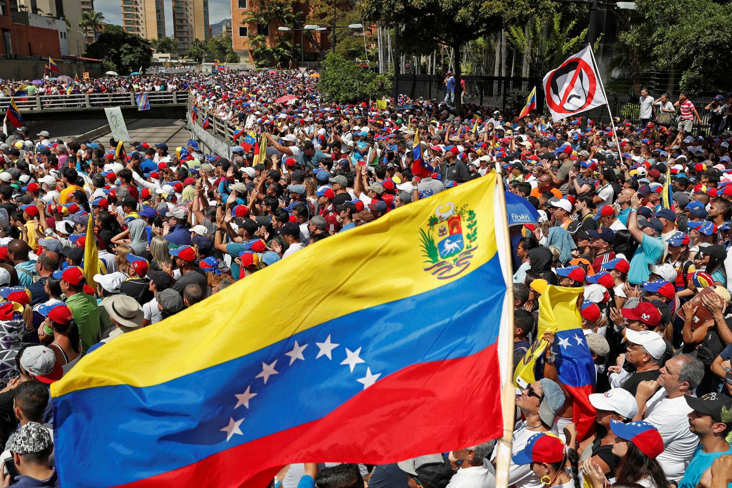 Opposition supporters take part in a rally against Venezuelan President Nicolas Maduro's government and to commemorate the 61st anniversary of the end of the dictatorship of Marcos Perez Jimenez in Caracas, Venezuela January 23, 2019. REUTERS/Carlos Garcia Rawlins - RC152D5EE530