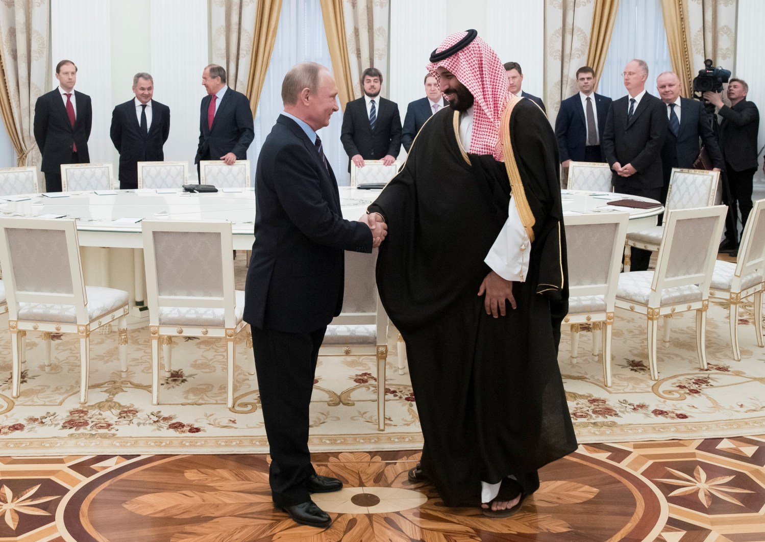 Russian President Vladimir Putin shakes hands with Saudi Deputy Crown Prince and Defence Minister Mohammed bin Salman during a meeting at the Kremlin in Moscow, Russia, May 30, 2017. REUTERS/Pavel Golovkin/Pool - RC19885B9FF0