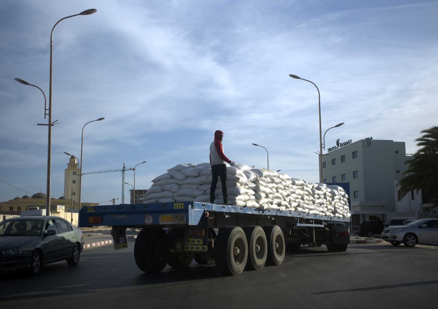 A truck laden with fishmeal for export is driven from the main port in Nouadhibou, Mauritania, April 13, 2018. Picture taken April 13, 2018. To match Special Report OCEANS-TIDE/SARDINELLA    REUTERS/Sylvain Cherkaoui - RC1C78334E10