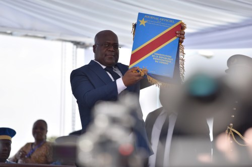 Felix Tshisekedi holds up the constitution during the inauguration ceremony whereby Tshisekedi was sworn into office as the new president of the Democratic Republic of Congo at the Palais de la Nation in Kinshasa, Democratic Republic of Congo January 24, 2019. REUTERS/Olivia Acland - RC143472C080