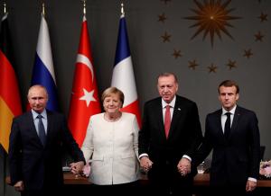 German Chancellor Angela Merkel, Russian President Vladimir Putin, Turkish President Tayyip Erdogan and French President Emmanuel Macron attend a news conference after a Syria summit, in Istanbul, Turkey October 27, 2018. REUTERS/Murad Sezer     TPX IMAGES OF THE DAY - RC1284F2EEB0