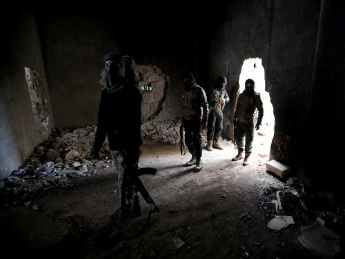 Turkish-backed Syrian rebels walk as they hold their weapons in the town of Tadef in Aleppo Governorate, Syria January 3, 2019. REUTERS/Khalil Ashawi - RC1F885BB650