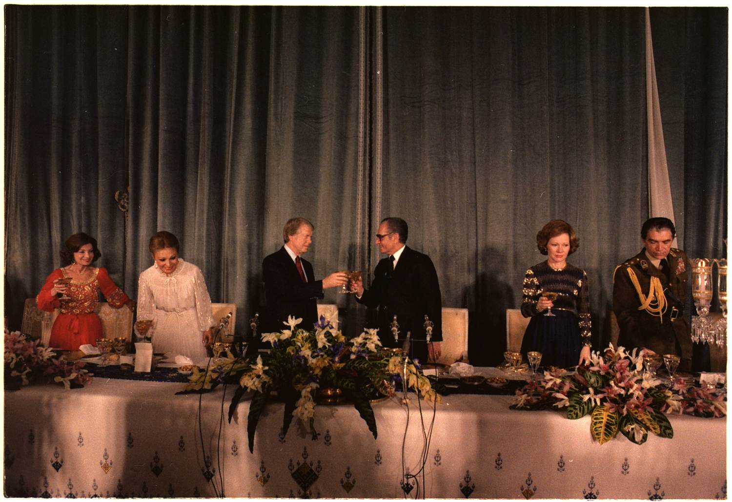Jimmy Carter and the Shah toast at a State Dinner hosted by the Shah of Iran.. Source: U.S. National Archives and Records Administration
