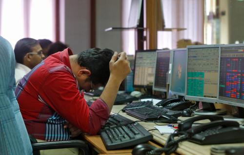 A broker reacts while trading at his computer terminal at a stock brokerage firm in Mumbai, India, February 26, 2016. Indian bonds, shares and the rupee gained on Friday after a key government report on the economy was seen as calling for fiscal prudence and stable inflation, while also acknowledging risks to the growth outlook.  REUTERS/Shailesh Andrade - D1BESPFKCFAA