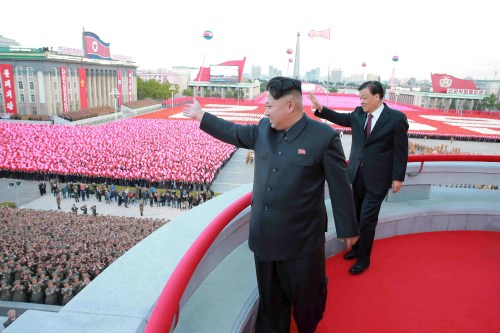 North Korean leader Kim Jong Un (L) and senior Chinese Communist Party official Liu Yunshan (R) wave during celebration of the 70th anniversary of the founding of the ruling Workers' Party of Korea, in this undated photo released by North Korea's Korean Central News Agency (KCNA) in Pyongyang on October 12, 2015. Isolated North Korea marked the 70th anniversary of its ruling Workers' Party on Saturday with a massive military parade overseen by leader Kim Jong Un, who said his country was ready to fight any war waged by the United States. REUTERS/KCNA          TPX IMAGES OF THE DAY       ATTENTION EDITORS - THIS PICTURE WAS PROVIDED BY A THIRD PARTY. REUTERS IS UNABLE TO INDEPENDENTLY VERIFY THE AUTHENTICITY, CONTENT, LOCATION OR DATE OF THIS IMAGE. FOR EDITORIAL USE ONLY. NOT FOR SALE FOR MARKETING OR ADVERTISING CAMPAIGNS. NO THIRD PARTY SALES. THIS PICTURE IS DISTRIBUTED EXACTLY AS RECEIVED BY REUTERS, AS A SERVICE TO CLIENTS. SOUTH KOREA OUT. NO COMMERCIAL OR EDITORIAL SALES IN SOUTH KOREA.  - GF10000241538