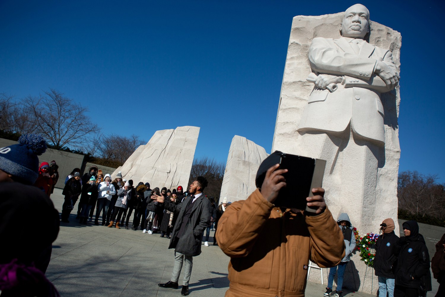 Brandon Stanard, 24, a student at Lincoln University, recites Martin Luther King, Jr.'s "I have a dream" speech to a gathering crowd at the base of a statue of the civil rights leader at the Martin Luther King, Jr. Memorial on Martin Luther King Jr. Day in Washington, U.S., January 21, 2019. REUTERS/Allison Shelley     TPX IMAGES OF THE DAY - RC1FB437CDE0