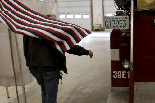 A voter exits a voting booth after filling out his ballot in the U.S. presidential primary election at the Stark Volunteer  Fire Department in the village of Stark, New Hampshire, February 9, 2016.  REUTERS/Mike Segar - GF10000302166
