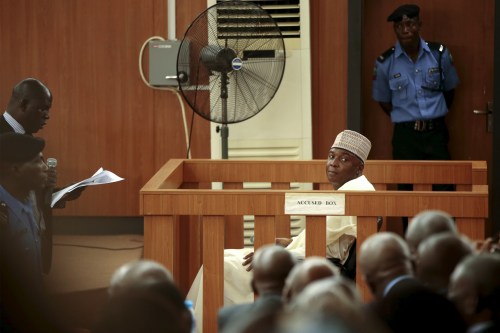 A court clerk reads the charges to Nigeria Senate President Bukola Saraki at the Code of Conduct Tribunal at Darki Biu, Jabi Abuja, Nigeria September 22, 2015. Nigeria's Senate President Bukola Saraki, the third most powerful person in the country, pleaded not guilty before the national Code of Conduct Tribunal on Tuesday to 13 charges of falsely declaring his assets. The tribunal, a special court that tries asset declaration misdemeanors, charged Saraki last week and issued a warrant for his arrest on Friday after he failed to appear before the court.  REUTERS/Afolabi Sotunde      TPX IMAGES OF THE DAY      - GF10000216108