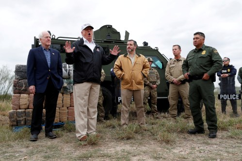 President Donald Trump speaks to reporters as he visits the banks of the Rio Grande River with Senator John Cornyn (R-TX), Senator Ted Cruz (R-TX) and U.S. Customs and Border Patrol agents during the president's visit to the U.S. - Mexico border in Mission, Texas, U.S., January 10, 2019. REUTERS/Leah Millis     TPX IMAGES OF THE DAY - RC1CEF41B3C0