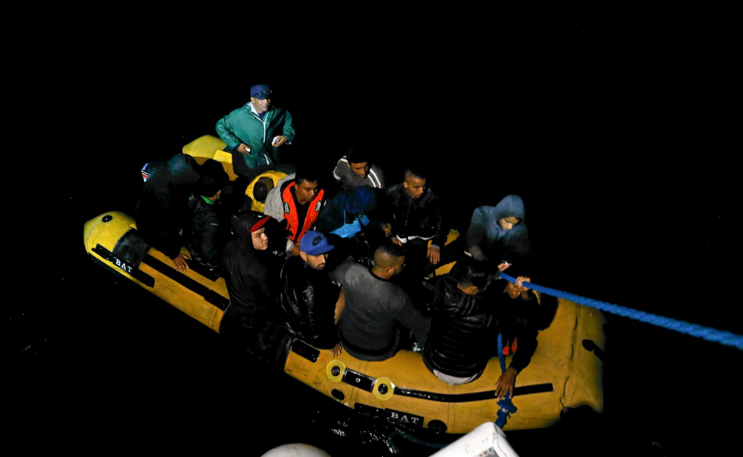 A group of Tunisian migrants arrive on a rubber boat after being rescued by the Tunisian  coast guard off the coast of Bizerte, Tunisia October 12, 2017. Picture taken October 12, 2017. REUTERS/Zoubeir Souissi - RC15BE82E6B0