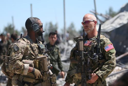 U.S. forces are seen at the Kurdish People's Protection Units (YPG) headquarters after it was hit by Turkish airstrikes in Mount Karachok near Malikiya, Syria April 25, 2017. REUTERS/ Rodi Said - RC12805A1220