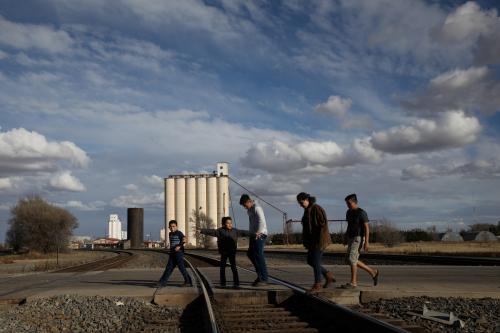 The children of Orfa, a migrant from Honduras, Rachel (second L), Carolina (second R) and Bayron (R), walk to a park to play with neighbours Jose (L) and Jefferson (C) in Texico, New Mexico, U.S., November 30, 2018. REUTERS/Loren Elliott  SEARCH "ELLIOTT ORFA" FOR THIS STORY. SEARCH "WIDER IMAGE" FOR ALL STORIES. - RC1CBD42DD70