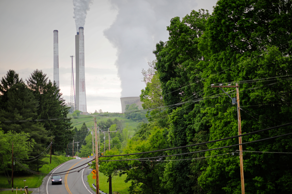 Exhaust rises from the stacks of the Harrison Power Station in Haywood, West Virginia, U.S., May 16, 2018. Picture taken May 16, 2018. To match Special Report USA-COAL/LABS. REUTERS/Brian Snyder