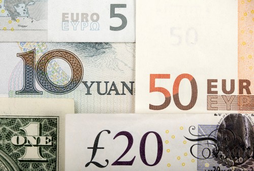 Arrangement of various world currencies including Chinese Yuan, US Dollar, Euro, British Pound, shot January 25, 2011.  REUTERS/Kacper Pempel/Illustration/File Photo  - S1AEUFNVHWAB