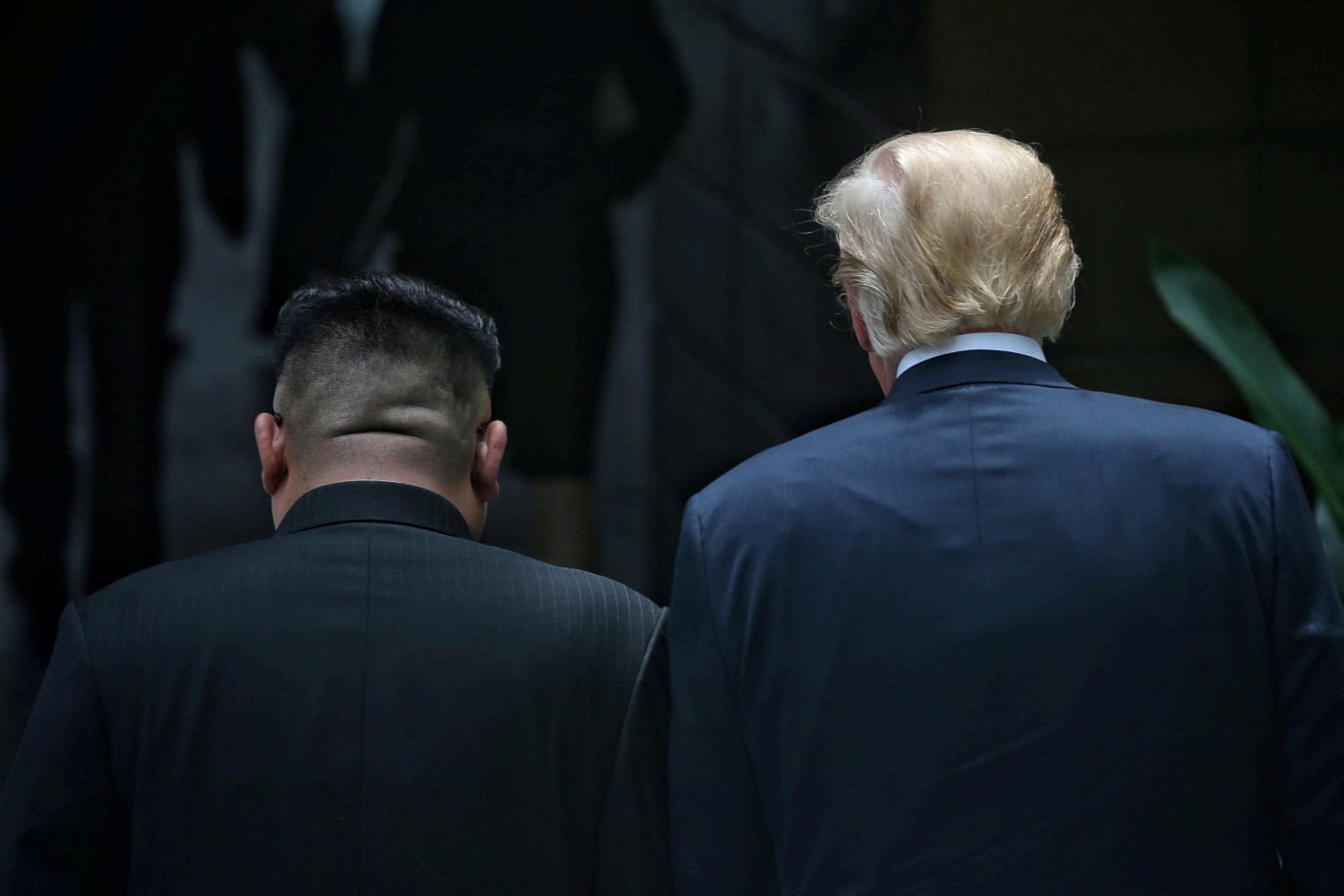 U.S. President Donald Trump walks with North Korean leader Kim Jong Un at the Capella Hotel on Sentosa island in Singapore June 12, 2018. Kevin Lim/The Straits Times via REUTERS ATTENTION EDITORS - THIS PICTURE WAS PROVIDED BY A THIRD PARTY     TPX IMAGES OF THE DAY - RC1464F28D00