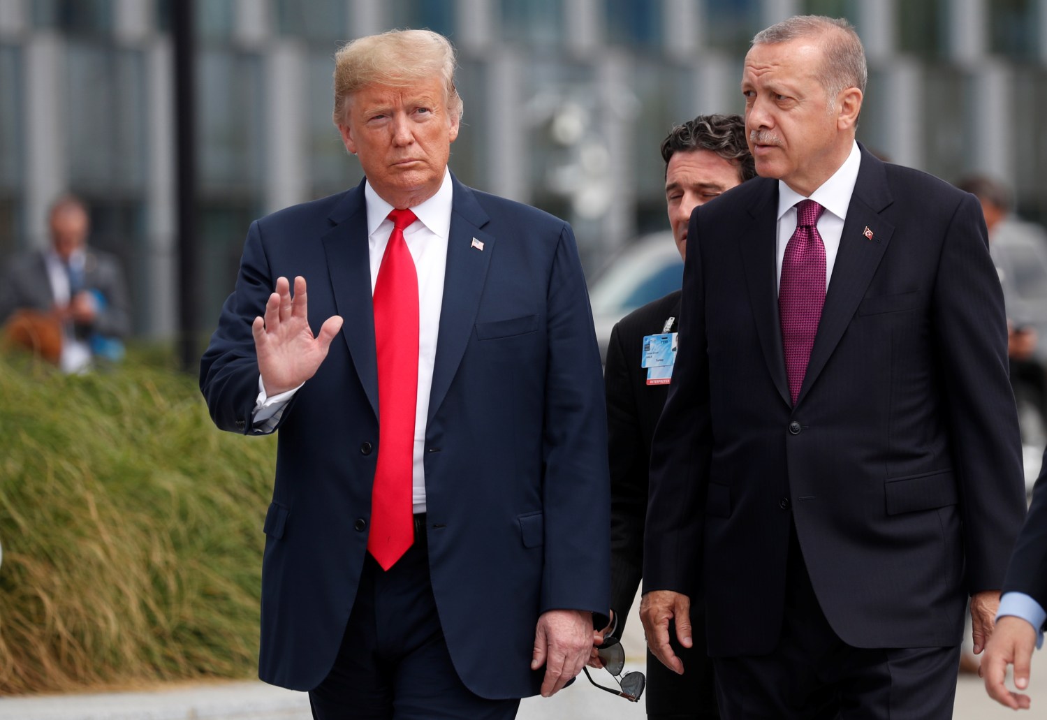 U.S. President Donald Trump and Turkish President Tayyip Erdogan attend the start of the NATO summit in Brussels, Belgium July 11, 2018. REUTERS/Kevin Lamarque