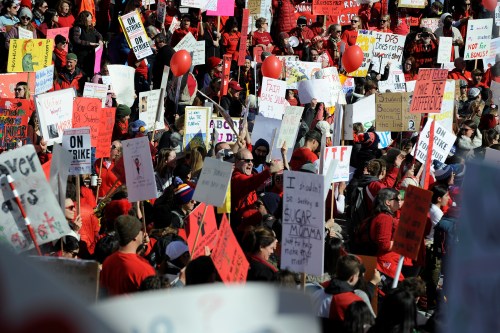 Teachers, students and members of the community hold a rally in Civic Center Park as Denver public school teachers strike for a second day in Denver, Colorado, U.S., February 12, 2019. REUTERS/Michael Ciaglo - RC1DE9397C20