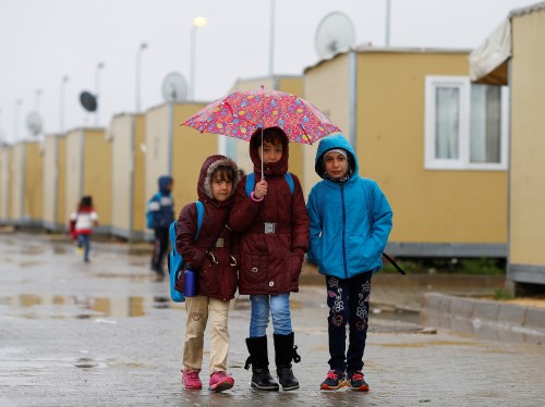 Syrian refugee children walk in Elbeyli refugee camp near the Turkish-Syrian border in Kilis province, Turkey, December 1, 2016. REUTERS/Umit Bektas - RC138BB33480