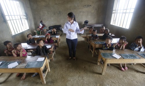 Giang Thi May teaches a first grade class at the primary school of Van Chai in Dong Van district, on the border with China, north of Hanoi, Vietnam, September 21, 2015. There is no electricity and no books. She teaches the children in the local Hmong language. Nearly three years after Taliban gunmen shot Pakistani schoolgirl Malala Yousafzai, the teenage activist last week urged world leaders gathered in New York to help millions more children go to school. World Teachers' Day falls on 5 October, a Unesco initiative highlighting the work of educators struggling to teach children amid intimidation in Pakistan, conflict in Syria or poverty in Vietnam. Even so, there have been some improvements: the number of children not attending primary school has plummeted to an estimated 57 million worldwide in 2015, the U.N. says, down from 100 million 15 years ago. Reuters photographers have documented learning around the world, from well-resourced schools to pupils crammed into corridors in the Philippines, on boats in Brazil or in crowded classrooms in Burundi.  REUTERS/Kham  TPX IMAGES OF THE DAYPICTURE 33 OF 47 FOR WIDER IMAGE STORY "SCHOOLS AROUND THE WORLD"SEARCH "EDUCATORS SCHOOLS" FOR ALL IMAGES      TPX IMAGES OF THE DAY      - GF10000226464