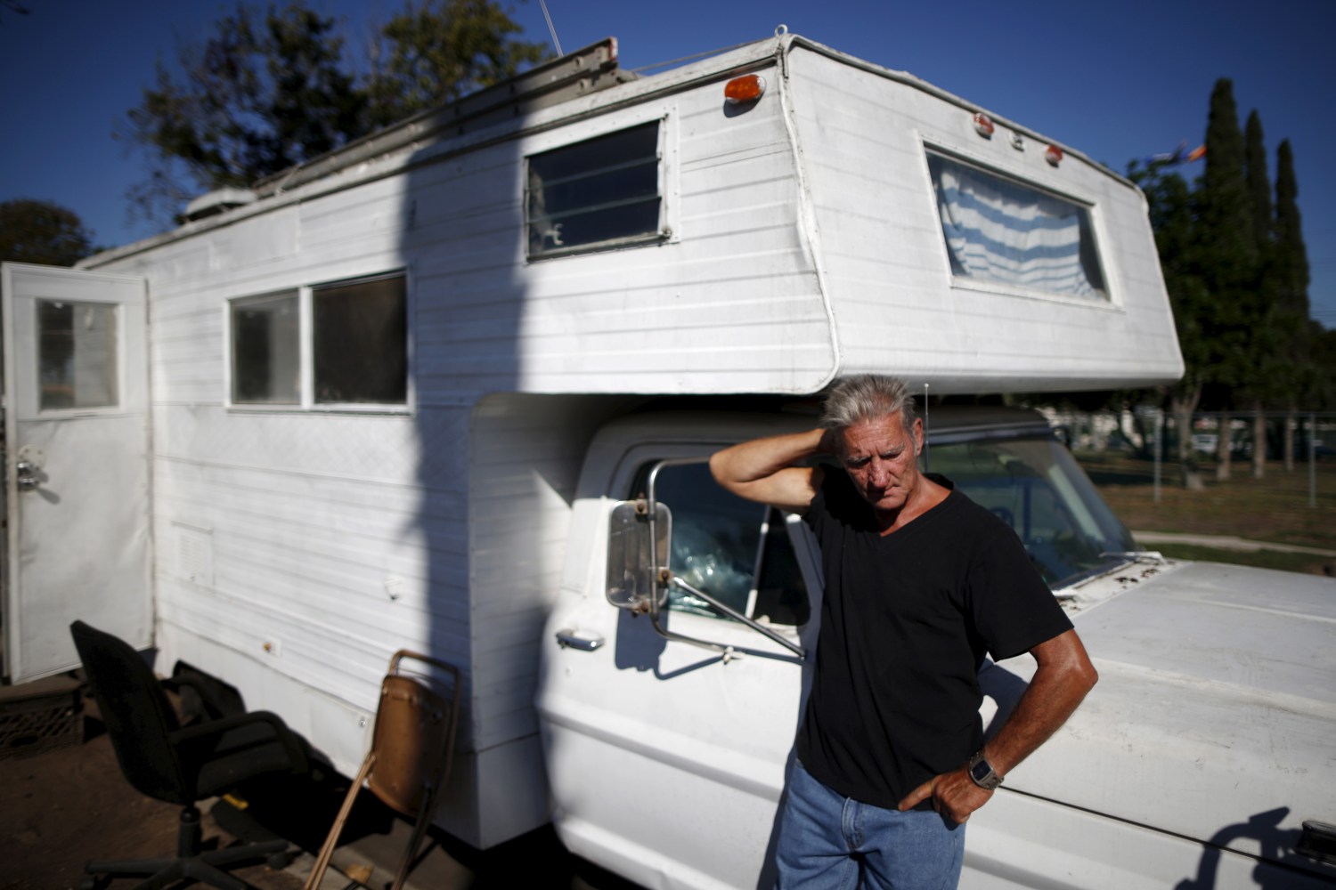 Nathan Allen, 65, poses for a portrait in front of the motorhome where he sleeps in a homeless RV and tent encampment near LAX airport in Los Angeles, California, United States, October 26, 2015. Allen lost his job as a handyman, and so couldn't afford to pay the rent for his apartment. Los Angeles is grappling with a massive homelessness problem, as forecasted El Nino downpours threaten to add to the misery of thousands of people who sleep on the streets. Mayor Eric Garcetti has proposed spending $100 million to combat the problem in the sprawling metropolis but stopped short of declaring a state of emergency. REUTERS/Lucy Nicholson PICTURE 16 OF 17 - SEARCH "NICHOLSON MOTORHOME" FOR ALL IMAGES - GF10000270563
