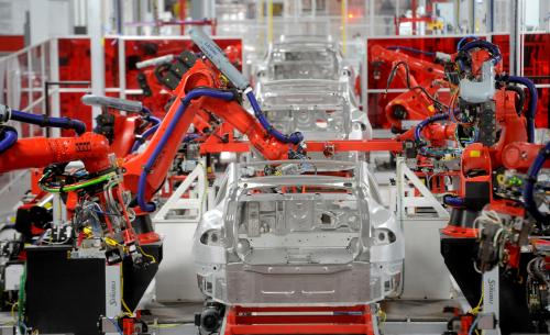Robotic arms assemble Tesla's Model S sedans at the company's factory in Fremont, California, June 22, 2012. Tesla began delivering the electric sedan to customers on June 22.   REUTERS/Noah Berger   (UNITED STATES - Tags: TRANSPORT SCIENCE TECHNOLOGY BUSINESS) - TM3E86M1CK701