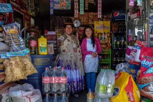 Lucia Mayta, 43, and her daughter Luz Cecilia, 12, pose for a photograph inside their bodega in La Paz February 24, 2014. Lucia studied until the fourth grade of primary school, and knows how to read and write and do basic math. Lucia runs a bodega, and the family live in a back room. She hopes to build a house in the future. Luz Cecilia is in seventh grade and wants to be a singer. On March 8 activists around the globe celebrate International Women's Day, which dates back to the beginning of the 20th century and has been observed by the United Nations since 1975. The UN writes that it is an occasion to commemorate achievements in women's rights and to call for further change. Picture taken February 24, 2014. REUTERS/David Mercado (BOLIVIA - Tags: SOCIETY EDUCATION)ATTENTION EDITORS: PICTURE 11 OF 32 FOR PACKAGE 'WOMEN'S DAY - MOTHERS AND DAUGHTERS' TO FIND ALL IMAGES SEARCH 'REUTERS MOTHERS DAUGHTERS' - GM1EA370T5701
