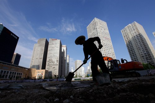 A labourer works at a construction site in Beijing's central business district July 12, 2012. China's economy may have grown around 7.5 percent in the second quarter and nearly 8 percent in the first half, and will recover steadily in the second half as policy stimulus gains traction, a senior economist at the cabinet's think-tank said on Thursday. REUTERS/Jason Lee (CHINA - Tags: BUSINESS POLITICS EMPLOYMENT) - GM1E87C1DPX01