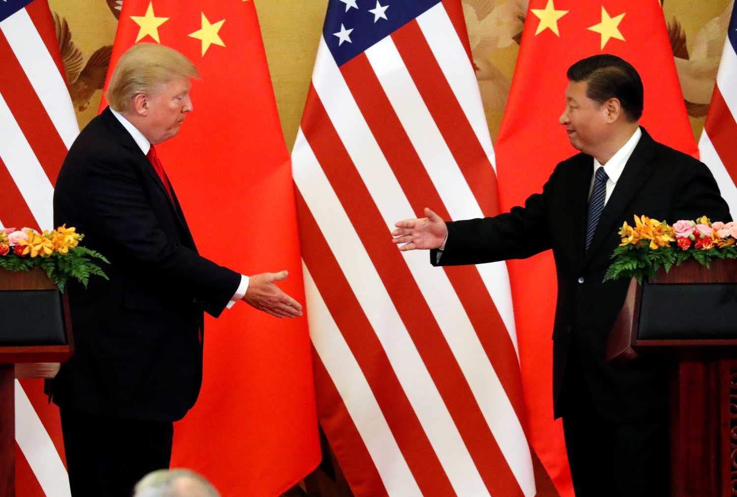 U.S. President Donald Trump and China's President Xi Jinping make joint statements at the Great Hall of the People in Beijing, China, November 9, 2017. REUTERS/Jonathan Ernst - RC16EDA92520