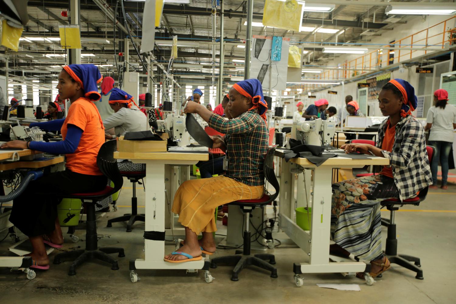 Workers sew clothes inside the Indochine Apparel PLC textile factory in Hawassa Industrial Park in Southern Nations, Nationalities and Peoples region, Ethiopia November 17, 2017. Picture taken November 17, 2017.REUTERS/Tiksa Negeri - RC1A972030A0