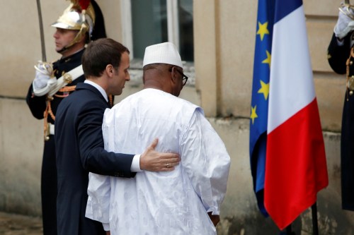 Mali's President Ibrahim Boubacar Keita is greeted by French President Emmanuel Macron as he hosts the leaders of the G5 Sahel countries - Mali, Burkina Faso, Niger, Chad and Mauritania, as well as Germany, Italy and and Saudi Arabia to discuss how to speed up the implementation of the G5 West African counter-terrorism force in La Celle Saint Cloud, near Paris, France, December 13, 2017. REUTERS/Philippe Wojazer - RC1CD5FF5400