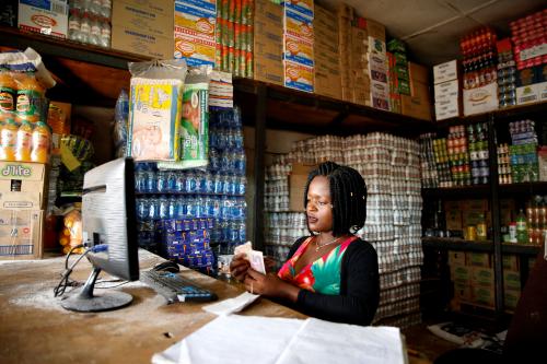 A woman counts cash as her shop opens in Harare, Zimbabwe, January 19, 2019. REUTERS/Philimon Bulawayo - RC1105111700