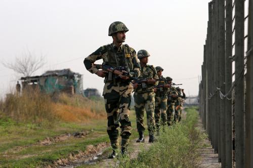 India's Border Security Force (BSF) soldiers patrol along the fenced border with Pakistan in Ranbir Singh Pura sector near Jammu February 26, 2019. REUTERS/Mukesh Gupta - RC1D32EEA1F0