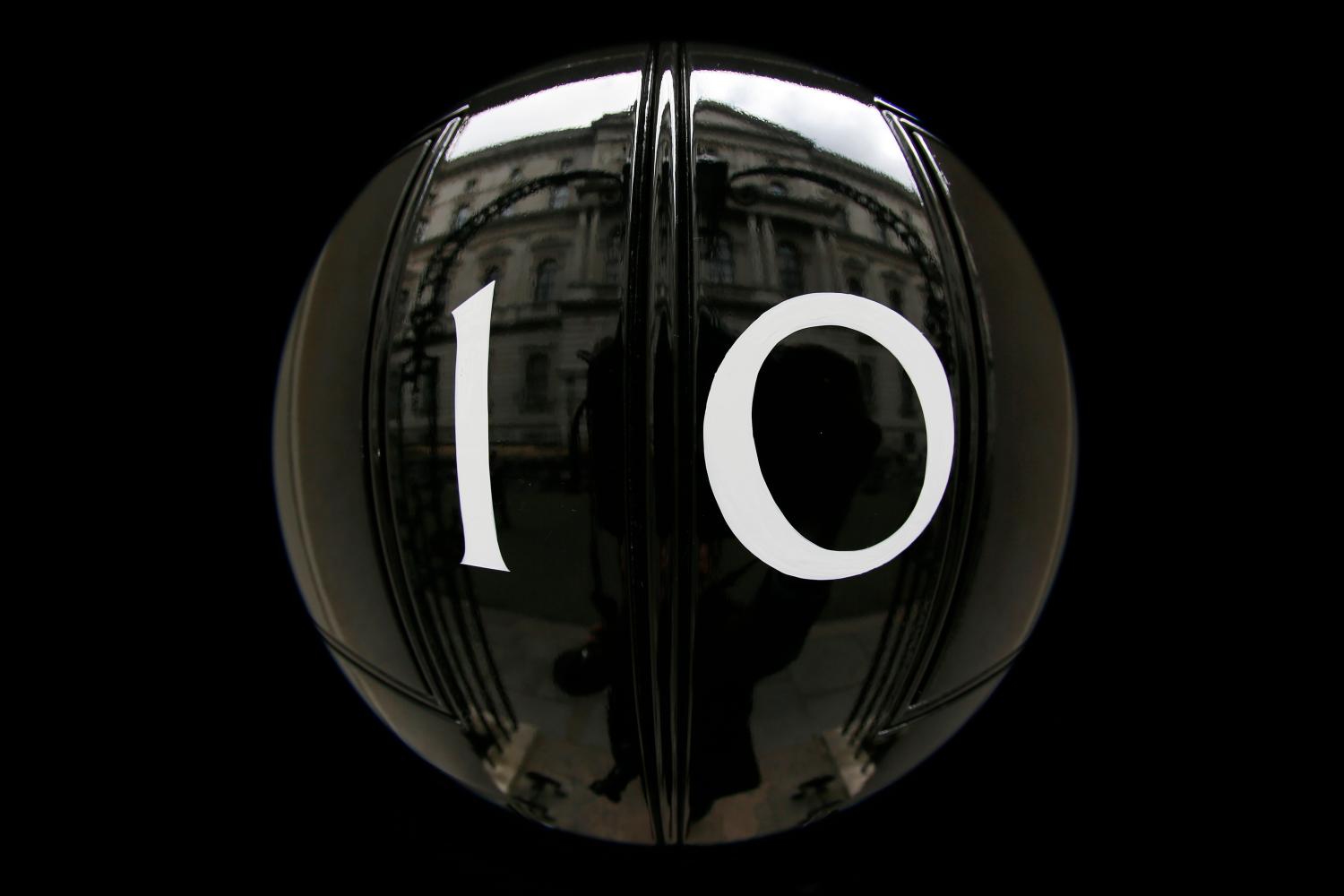 The door of number 10 Downing Street is seen in central London, Britain May 7, 2015. Picture taken with a fisheye lens. Britain goes to the polls today in a knife-edge national election to elect a new parliament and prime minsiter. REUTERS/Stefan Wermuth - LR2EB570P3HYC