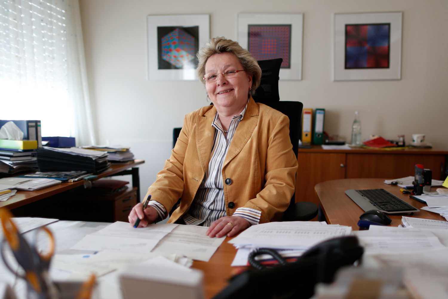 Ulrike Neveling 60-year old head of Accounting Department is pictured at her office at the headquarters of Rullko wholesale in Hamm March 4, 2014. Marie-Christine Ostermann is desperate to hang on to her older employees. There's already a shortage of skilled labour in Germany and a new draft law that lowers the pension age for some workers is adding to her problems. Six of the 150 staff at family-run food and kitchen supplies wholesaler Rullko say they'd like to retire at 63 this summer, when the new law is due to take effect. That's four years earlier than planned - a big worry for Ostermann. TO GO WITH GERMANY-PENSIONS/  REUTERS/Ina Fassbender  (GERMANY - Tags: BUSINESS EMPLOYMENT) - BM2EA341DLX01