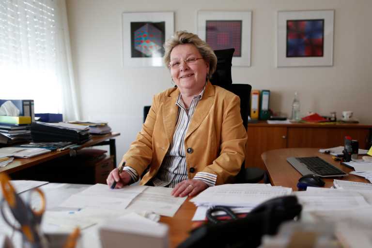 Ulrike Neveling 60-year old head of Accounting Department is pictured at her office at the headquarters of Rullko wholesale in Hamm March 4, 2014. Marie-Christine Ostermann is desperate to hang on to her older employees. There's already a shortage of skilled labour in Germany and a new draft law that lowers the pension age for some workers is adding to her problems. Six of the 150 staff at family-run food and kitchen supplies wholesaler Rullko say they'd like to retire at 63 this summer, when the new law is due to take effect. That's four years earlier than planned - a big worry for Ostermann. TO GO WITH GERMANY-PENSIONS/  REUTERS/Ina Fassbender  (GERMANY - Tags: BUSINESS EMPLOYMENT) - BM2EA341DLX01