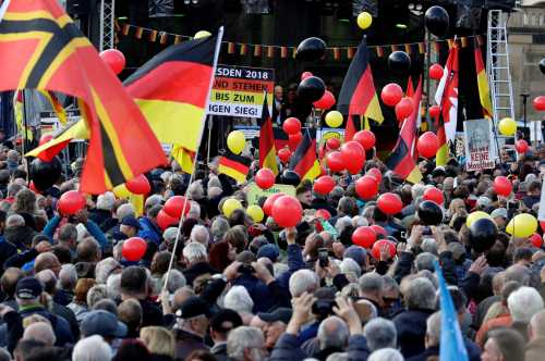 Supporters of the anti-Islam movement PEGIDA (Patriotic Europeans Against the Islamisation of the West) attend a demonstration in Dresden, Germany, October 21, 2018. REUTERS/David W. Cerny - RC126AC48970