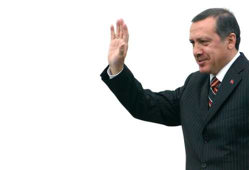 Turkish Prime Minister Tayyip Erdogan waves to his supporters upon his arrival at Esenboga Airport in Ankara.  Turkish Prime Minister Tayyip Erdogan waves to his supporters upon his arrival from Strasbourg at Esenboga Airport in Ankara, October 7, 2004. Erdogan praised as "balanced" an EU Commission report on Wednesday recommending European Union entry talks with Ankara, and said he hoped negotiations would start in early 2005.The recommendation to EU leaders, who will decide in December whether and when to start talks, gave a green light hedged with conditions including the possibility of suspending negotiations if Turkey backtracks on democracy and human rights. REUTERS/Umit Bektas - RP5DRIAILSAA