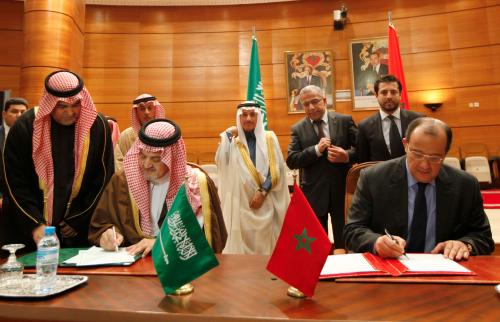 Morocco's Foreign Minister Taieb Fassi Fihri (R) and his Saudi counterpart Prince Saud al-Faisal sign an agreement during the 11th Moroccan-Saudi joint Commission in Rabat February 10, 2011. Saudi Arabia's King Abdullah bin Abdul-Aziz is alive and in "excellent shape," the Saudi foreign minister said on Thursday after Rumors about the king's health triggered a spike in the price of oil. REUTERS/Youssef Boudlal (MOROCCO - Tags: POLITICS ROYALS) - GM1E72B057701